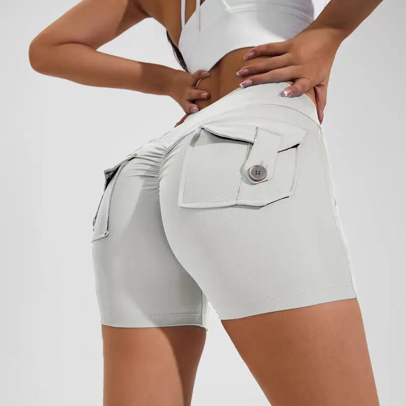 Women's high waist sport shorts in avocado green colour with pockets, on a mannequin.