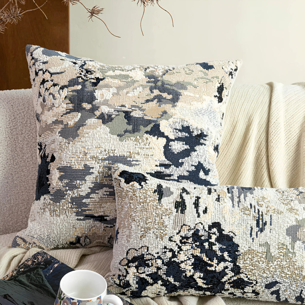 Blue floral pattern decorative pillow with feather velvet fill in wool blend cover.