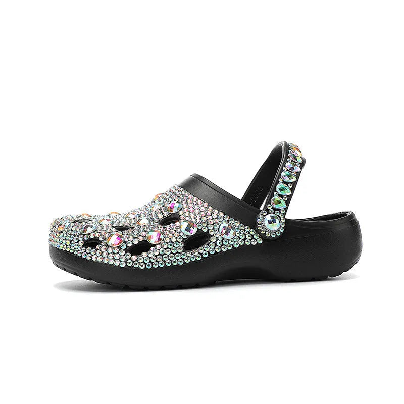 Black women's platform sandals with a perforated design and rhinestone details on the EVA upper.
