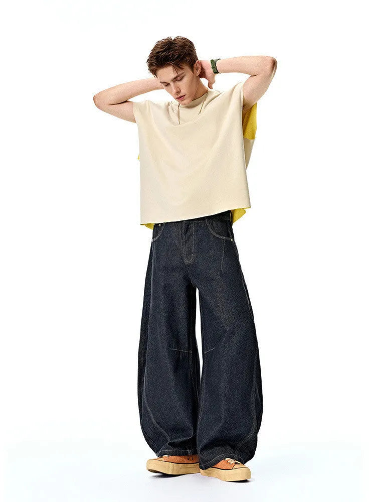 Men's wide leg denim trousers in original cow colour showing mid-waist design and cotton denim fabric