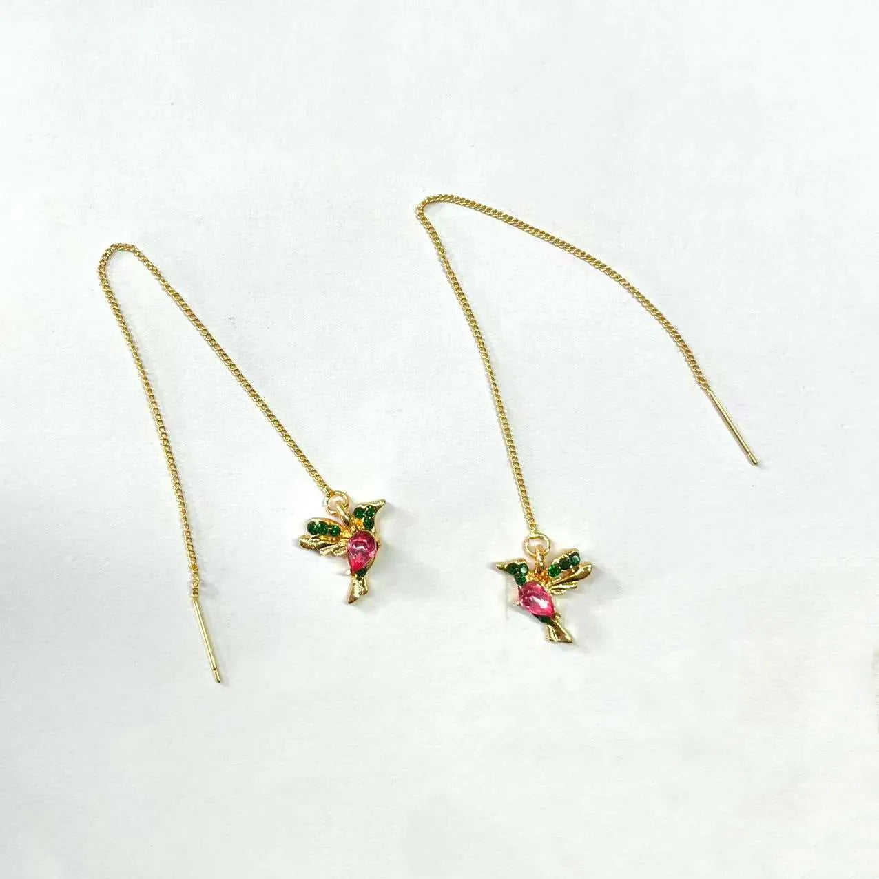 Long style hanging earrings featuring a bird design with mixed zirconium wings in red and blue electroplated alloy