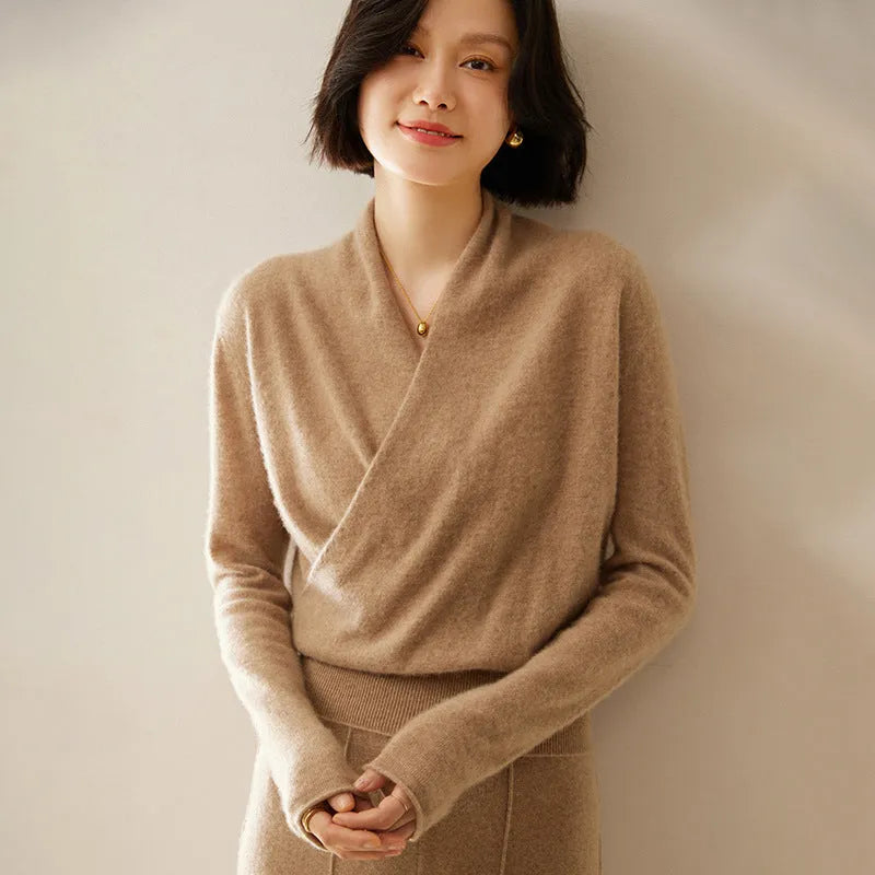 Women's solid colour cashmere V-neck cross sweater top with long sleeves in Elegant Camel, shown on a model.