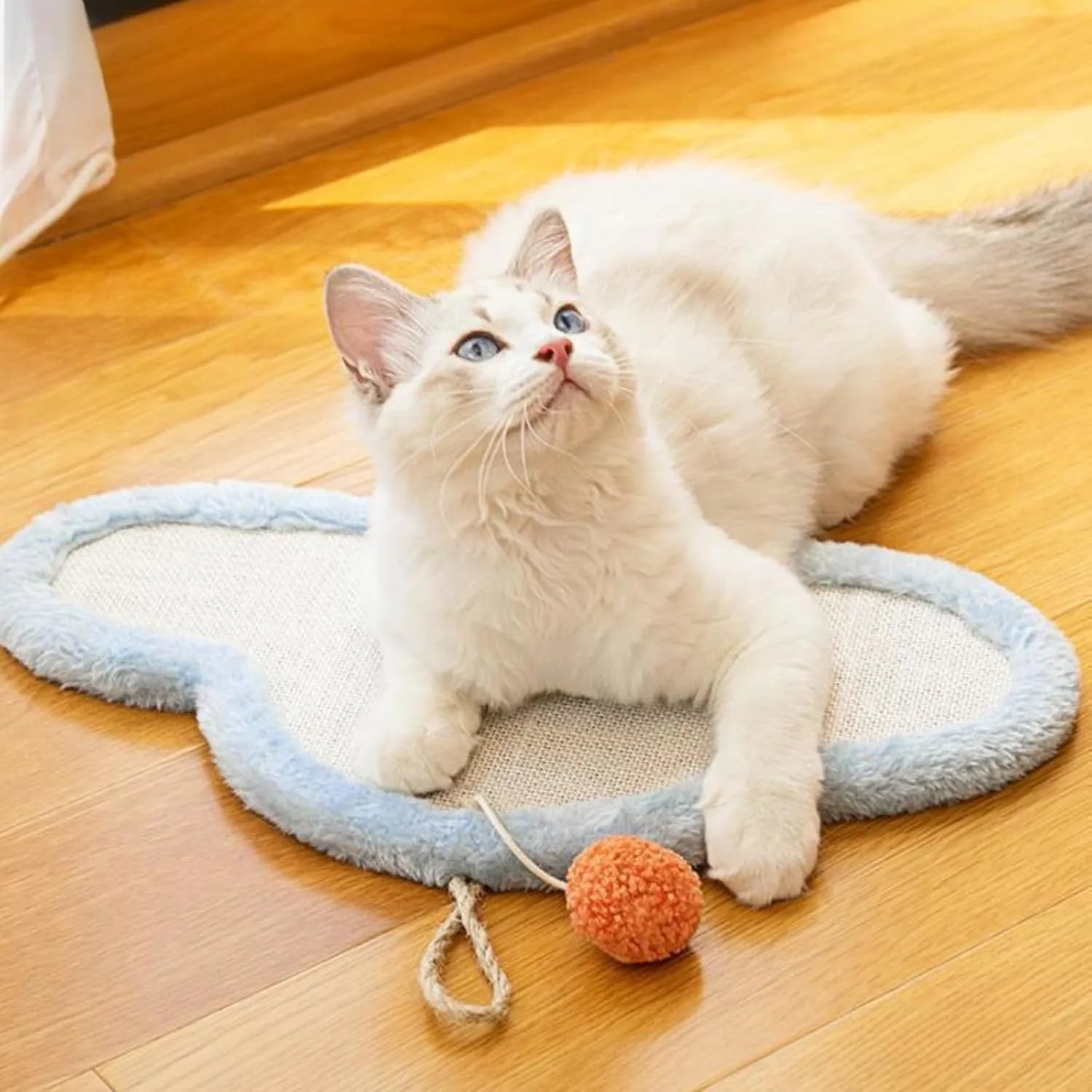 White cat scratching mat with sleeping cat cartoon design, made from natural sisal.