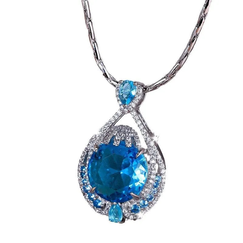 Blue geometric pendant necklace with fireworks-cut crystals on water wave chain