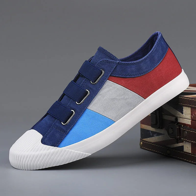 Men's low-top canvas sneakers in beige with elastic band closure and a vulcanised rubber sole.