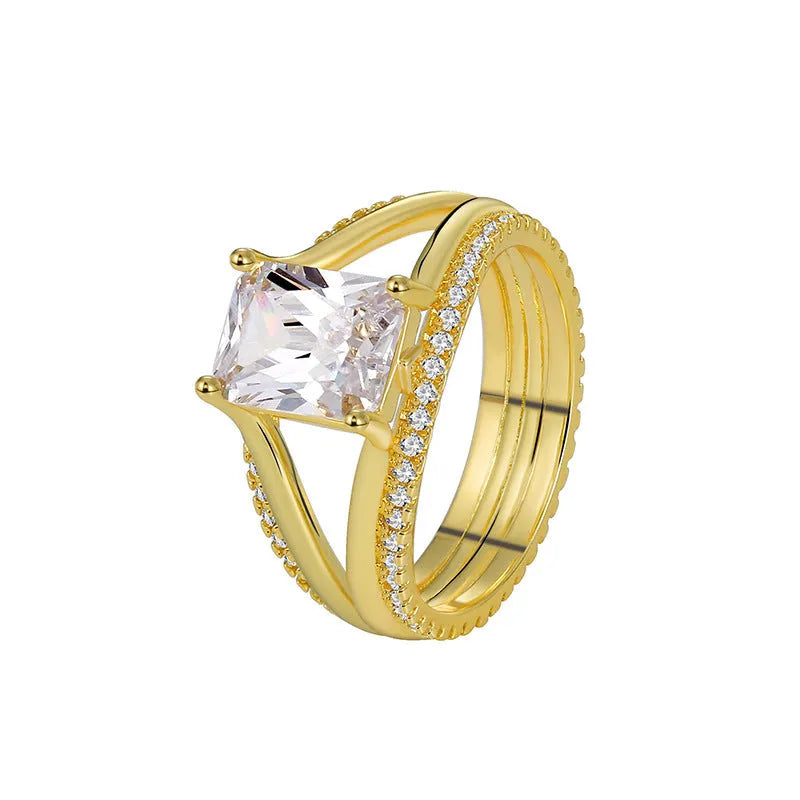 Geometric gold electroplated copper ring for women with a square zircon, shown in sizes 6 to 9.