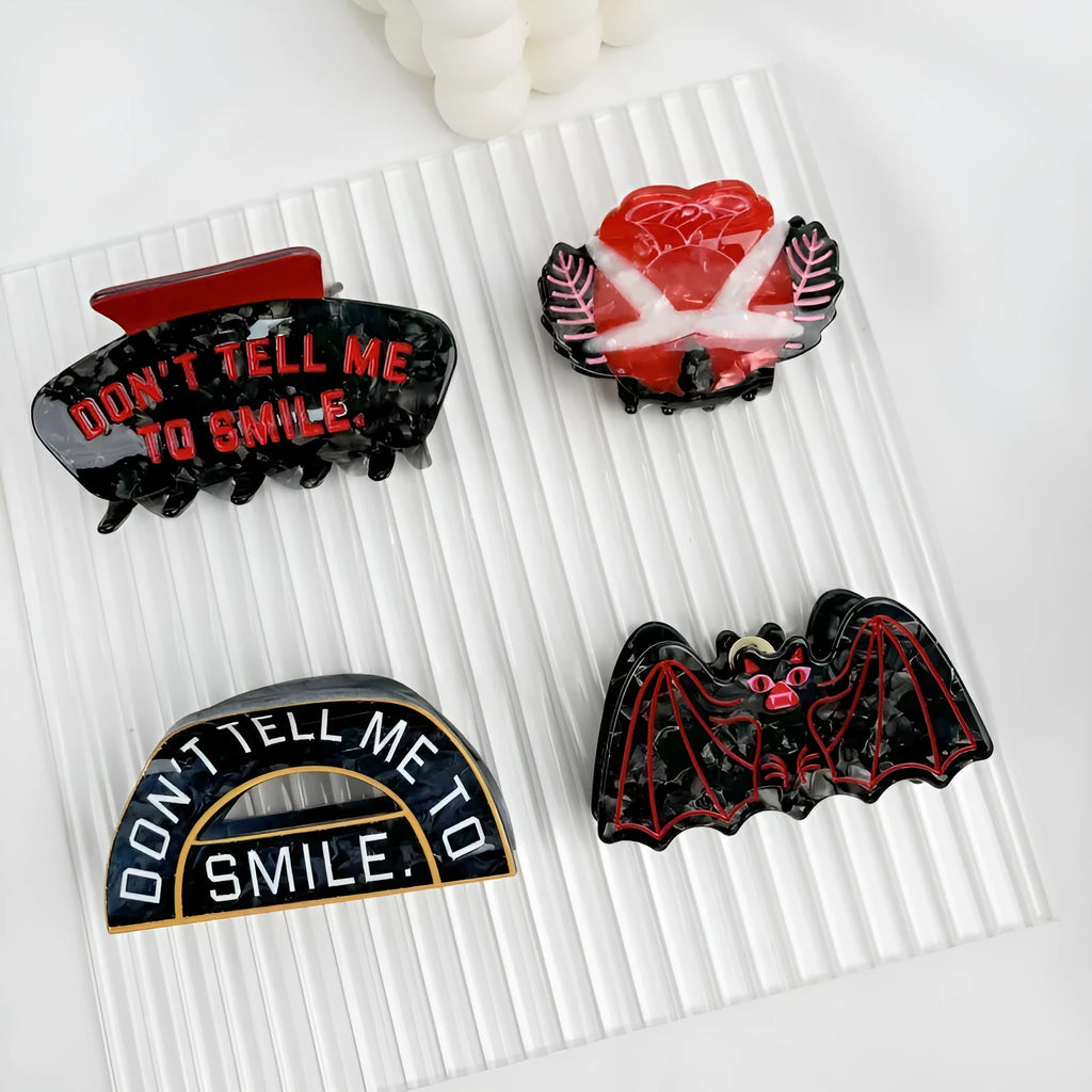 Handcrafted Halloween hair clip with detailed shark and bat design in acetic acid.
