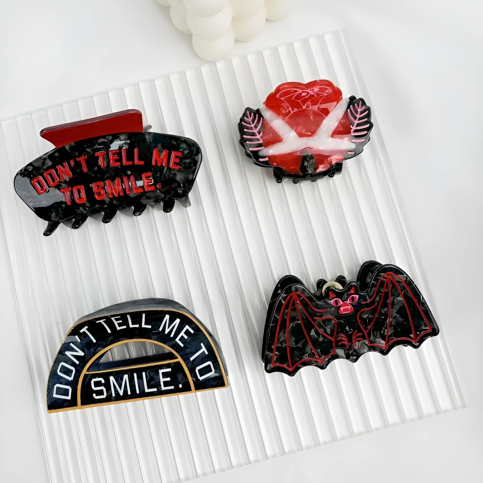 Handcrafted Halloween hair clip with detailed shark and bat design in acetic acid.