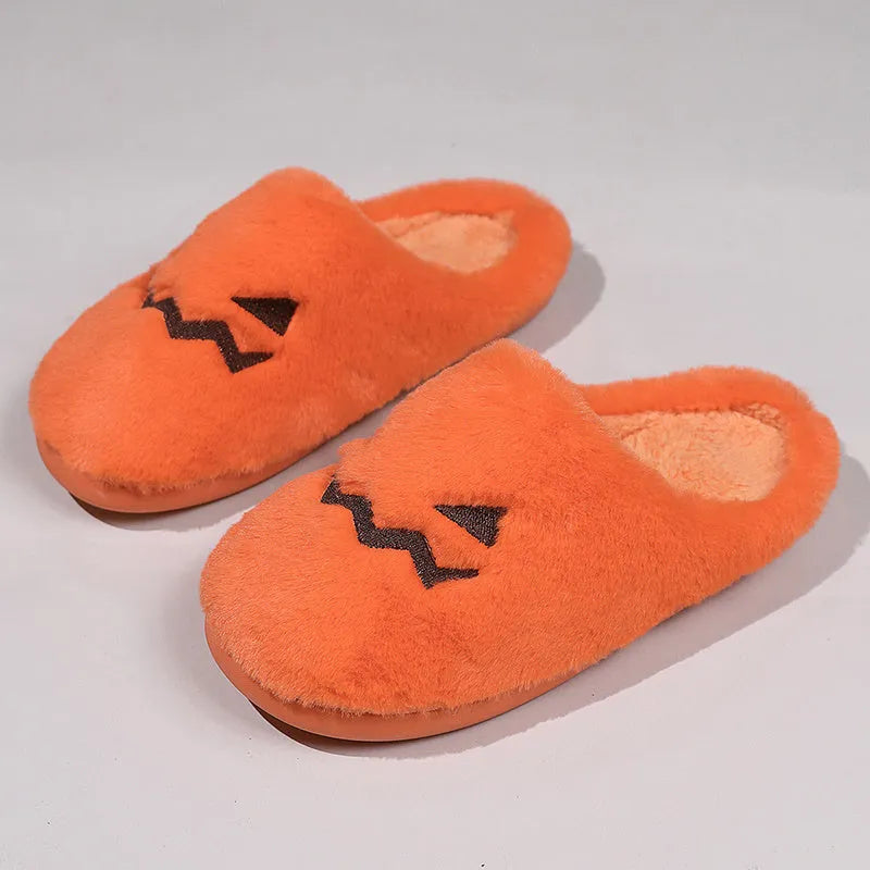 Orange Halloween pumpkin slippers with coral velvet exterior and plush lining