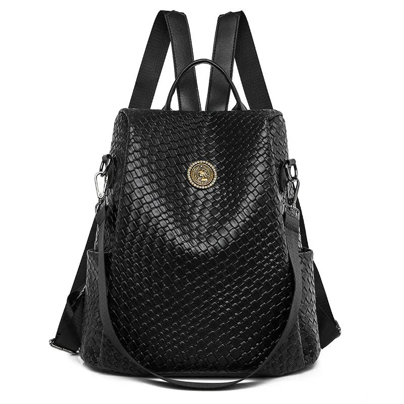Women's anti-theft backpack with waterproof PU construction showing organisational compartments and urban simplicity styling