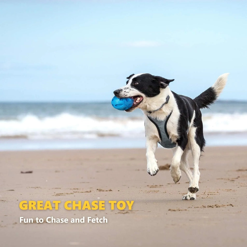 Blue, green, and orange natural rubber squeaky dog ball with textured surface grooves for aggressive chewers.
