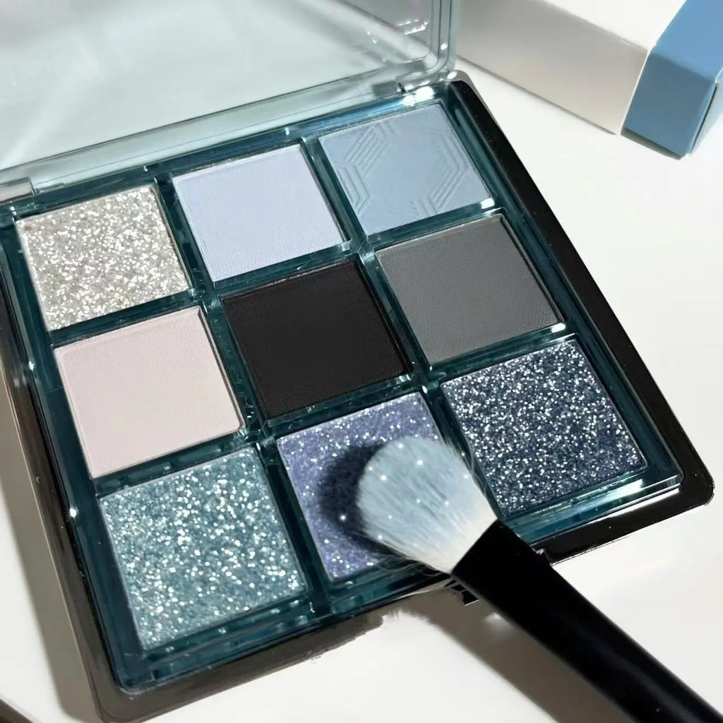 Nine-colour eye shadow palette with blue smoked shades showing matte and shimmer finishes