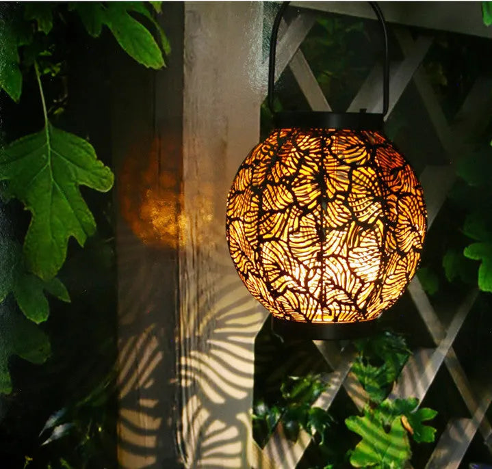 Solar courtyard lamp with decorative iron hollow design and integrated solar panel