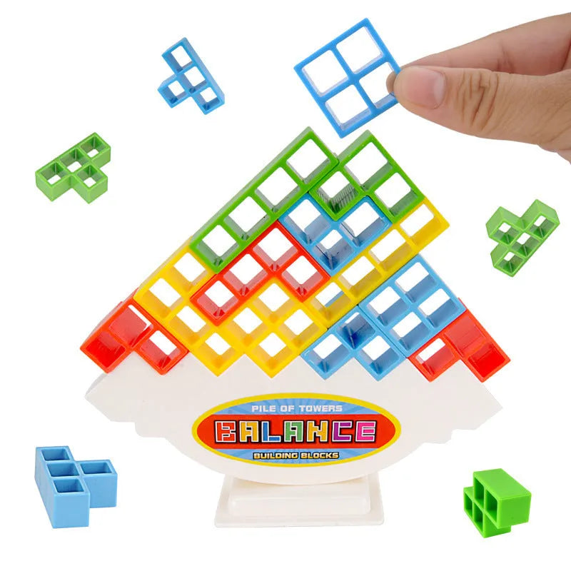 Plastic balance stacking game with coloured blocks on chassis for family play