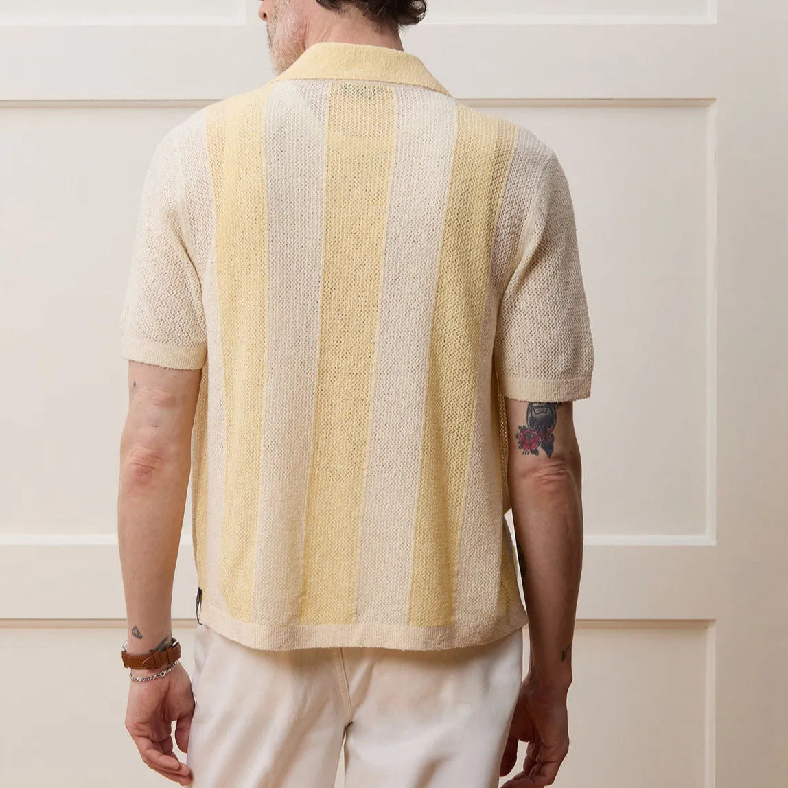 Yellow women's hollow-out polo shirt with asymmetric design and short sleeves