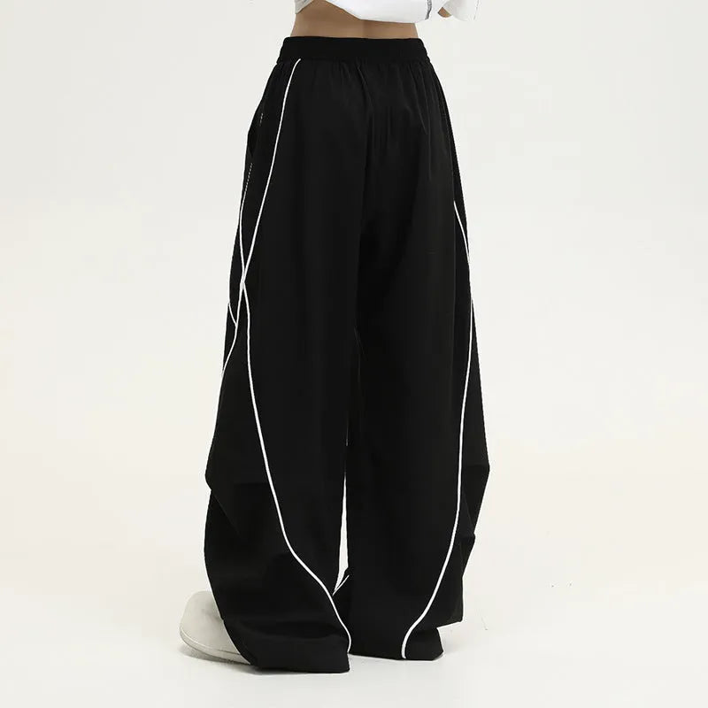 Black pleated wide-leg trousers with striped pattern for hip hop dance and streetwear