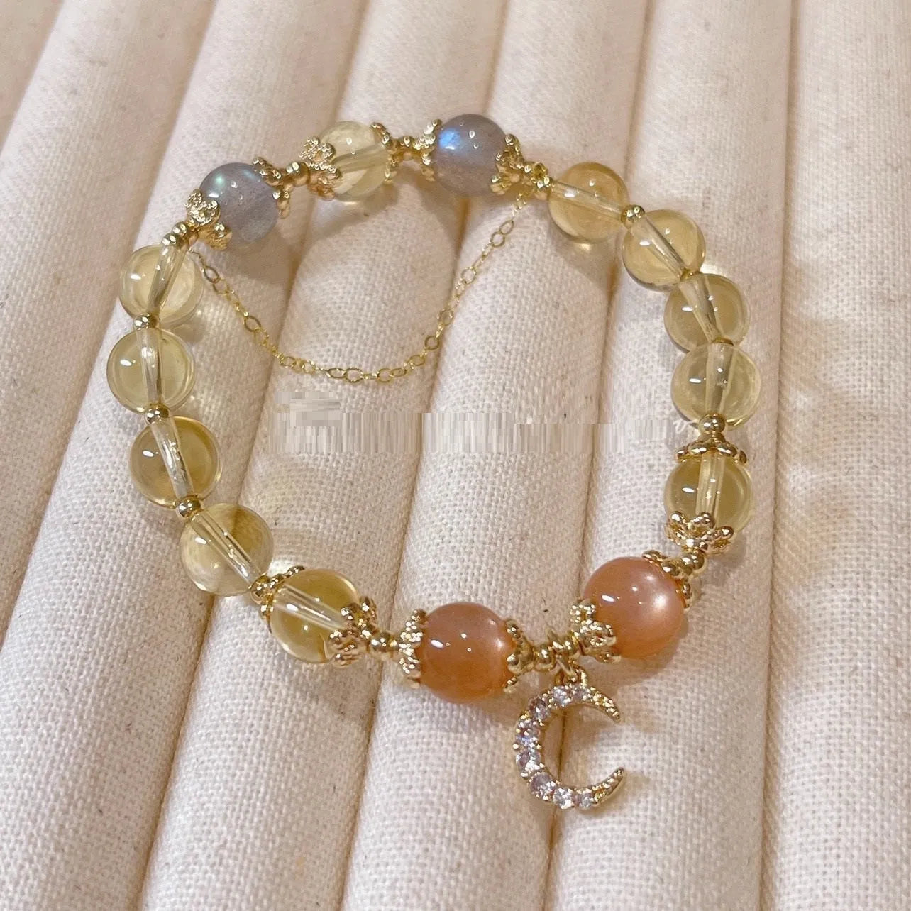 Chinese style women's crystal bracelet with a citrine moonstone and 14K gold electroplating.