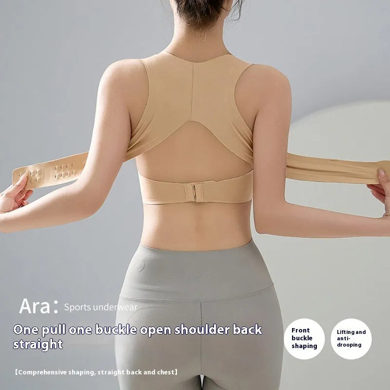 Women's black sports bra with front buckle closure and back shaping, shown on a size mannequin.