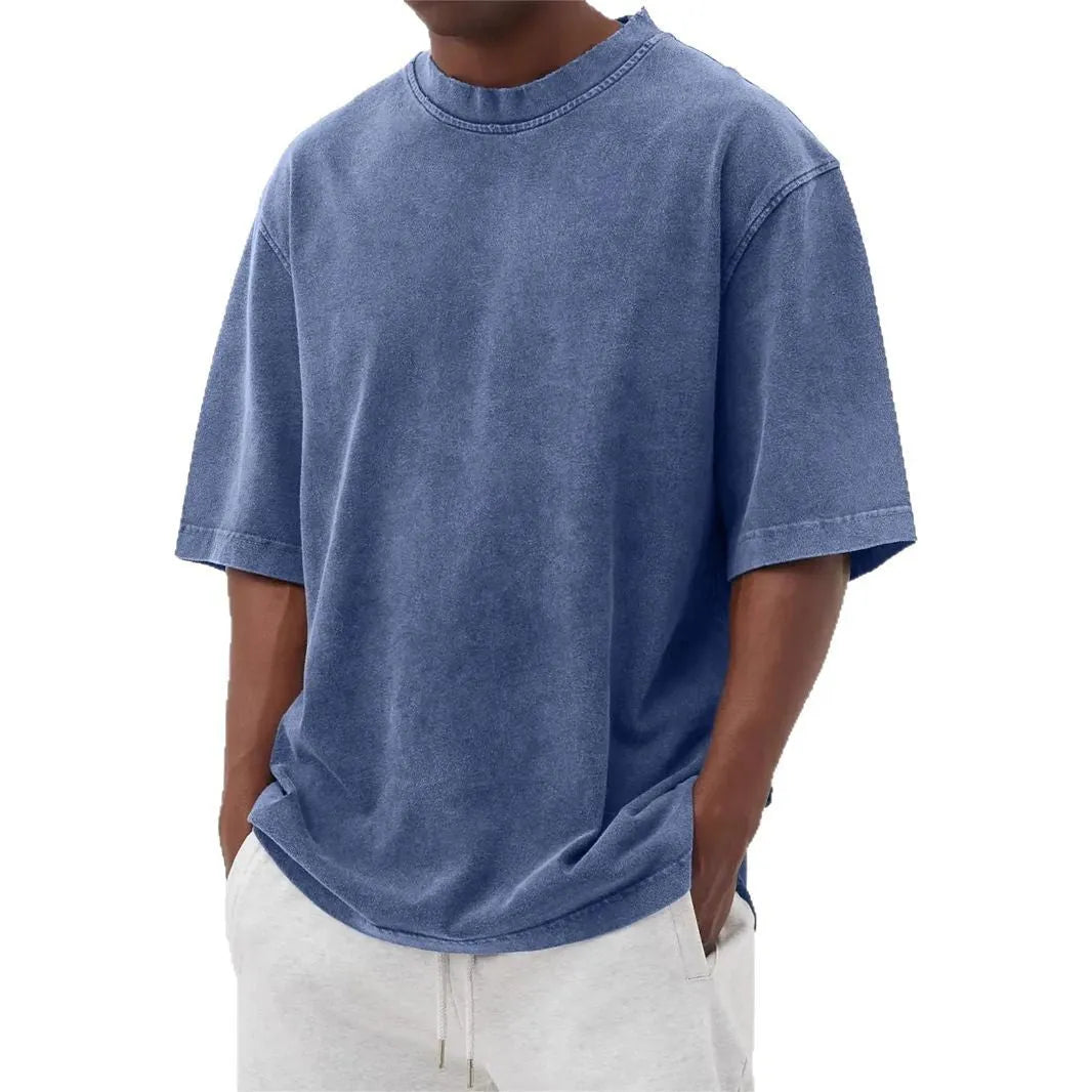 Men's loose fit distressed pullover T-shirt in solid colour options including blue, black, and army green