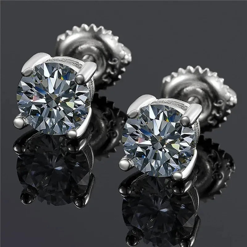 Silver geometric screw back moissanite stud earrings with four-claw setting on a black card.