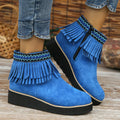 Women's dark brown suede wedge ankle boots with a side zip and waterproof platform sole.