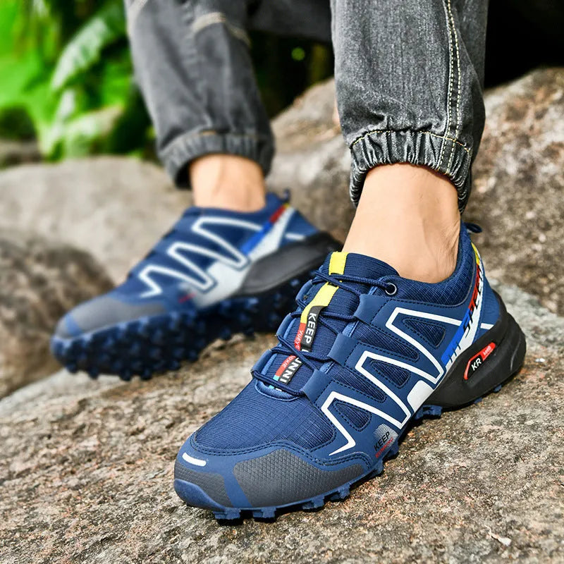 Men's grey-orange plus size casual shoes with synthetic leather upper and rubber sole.