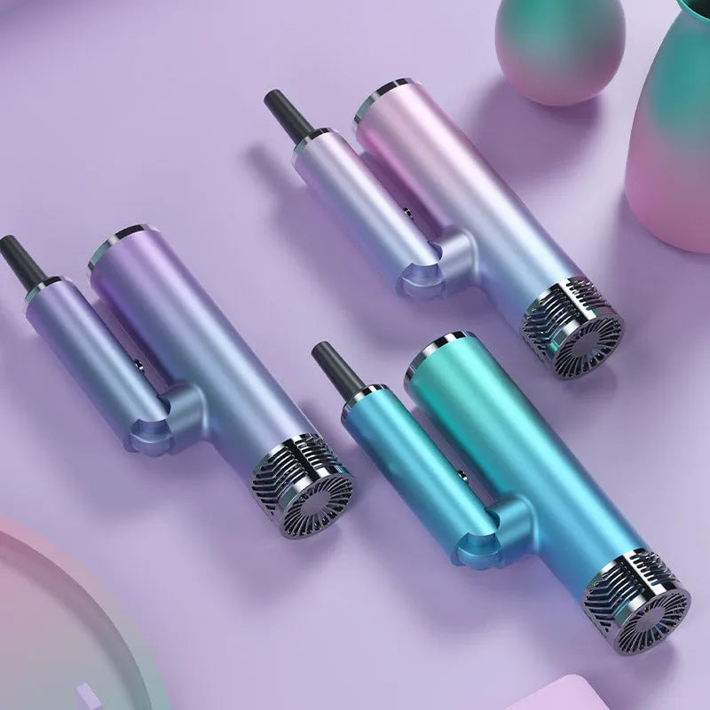 Green foldable hair dryer with collapsed handle next to a suitcase, demonstrating portable travel size.