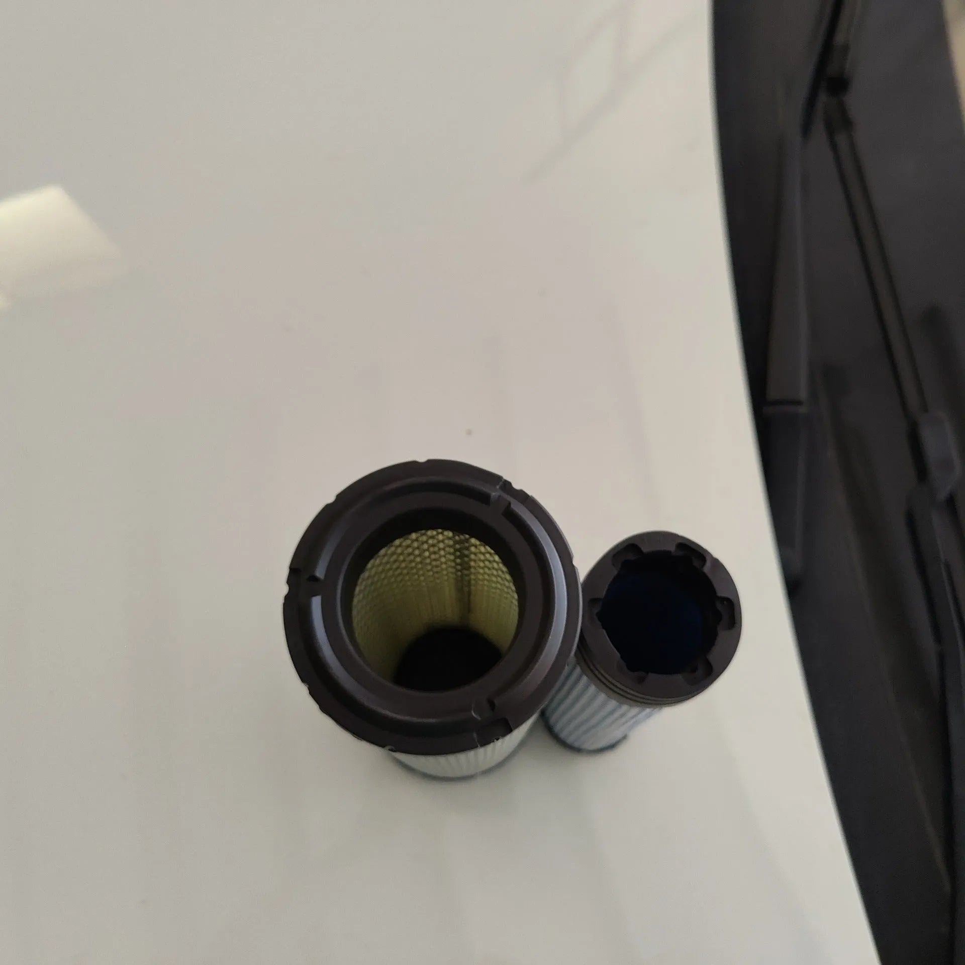 Donaldson 1027 straight head air filter with G057513 elbow, showing large circular filter element.