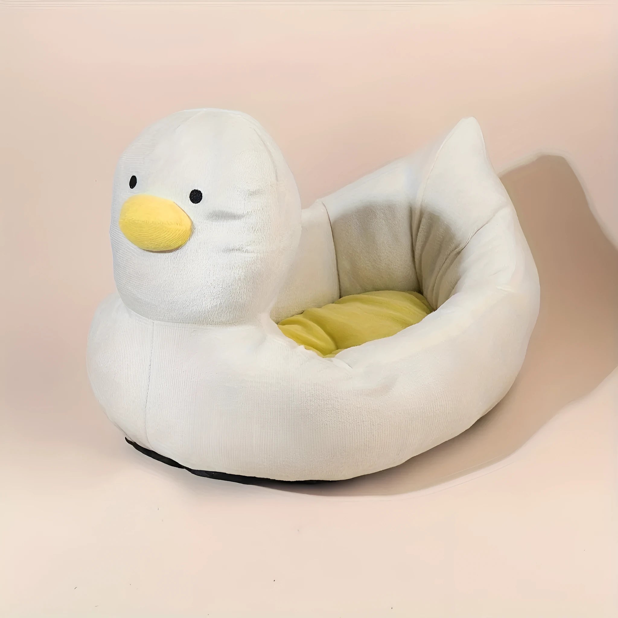 Blue duck-shaped fluffy pet bed sofa for small dogs and cats on a wooden floor.