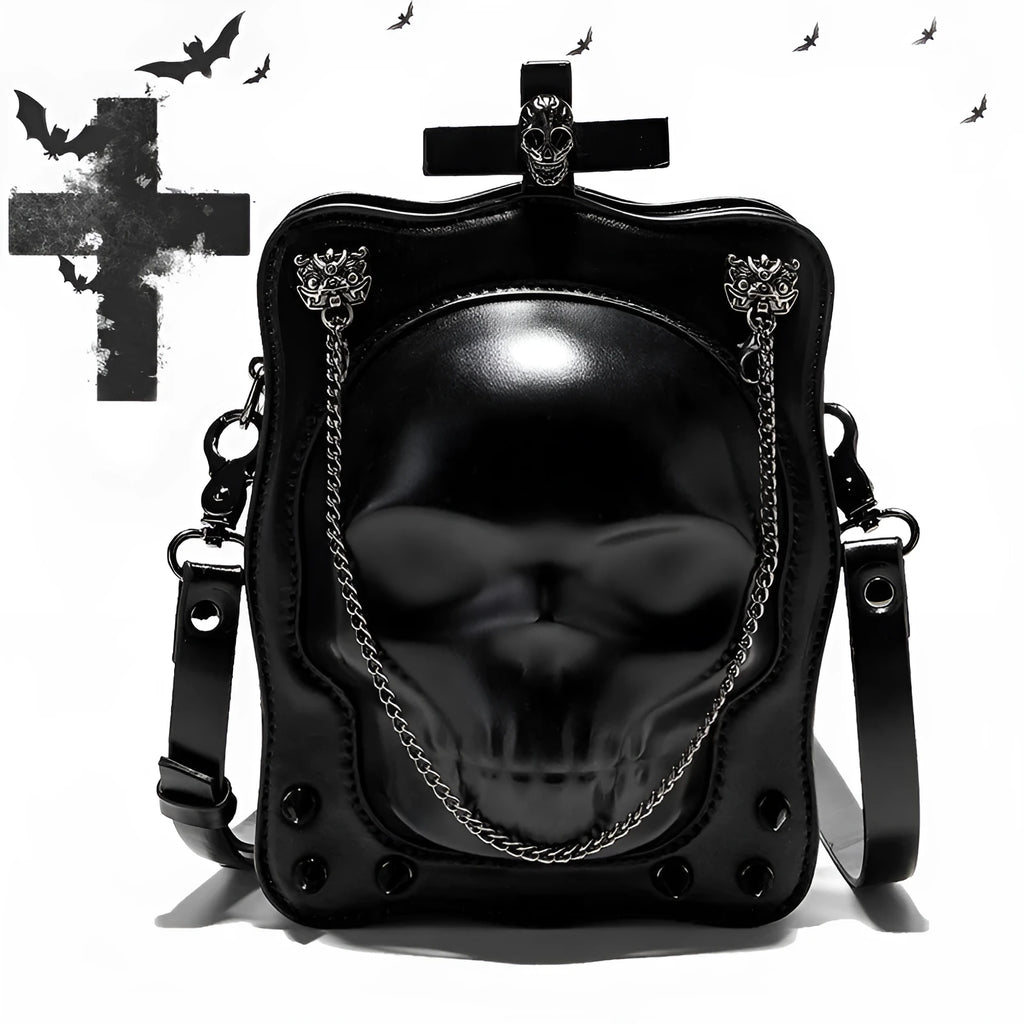 Black gothic crossbody bag with embossed skull design, chain strap and square shape