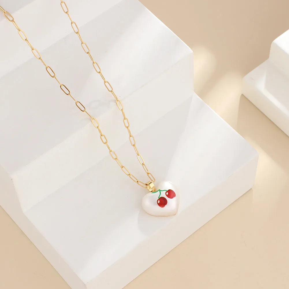 Adjustable heart-shaped necklace with fruit pendant charm showing five colour options