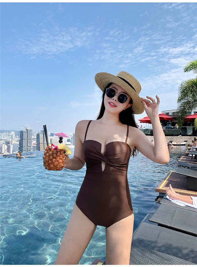 Ins Style women's solid colour push-up one-piece swimsuit with spaghetti straps in brown.