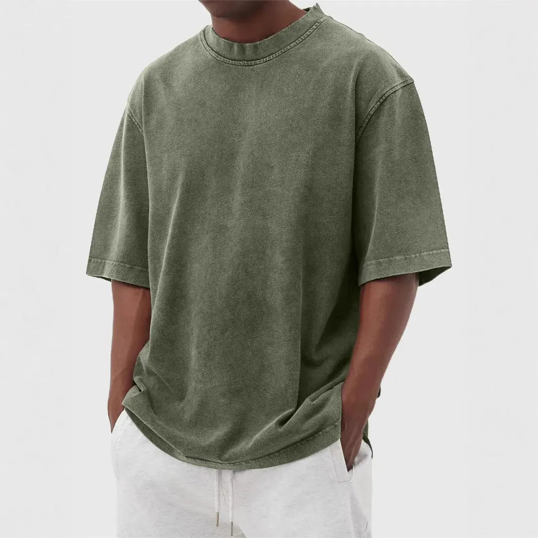 Men's loose fit distressed pullover T-shirt in solid colour options including blue, black, and army green