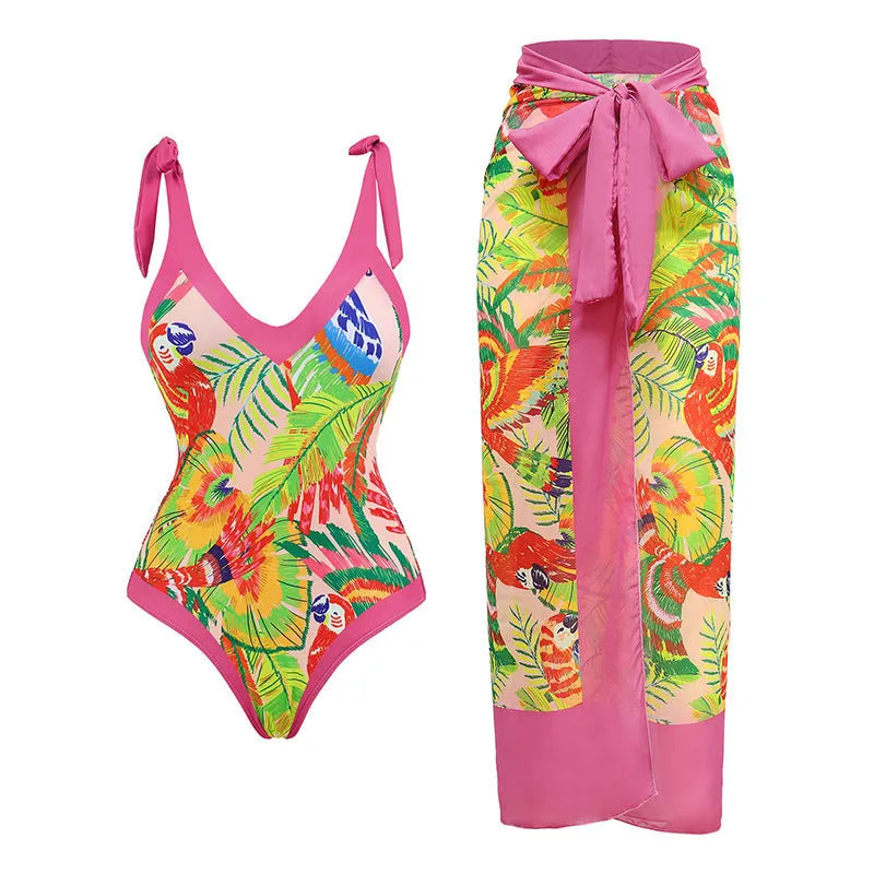 Pink floral print one-piece swimsuit with V-neck, covered belly design, and attached thin skirt