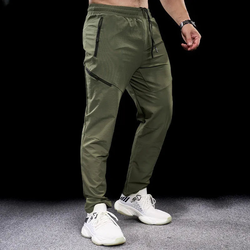 Men's waterproof quick-dry exercise pants in nylon fabric for sports and fitness activities