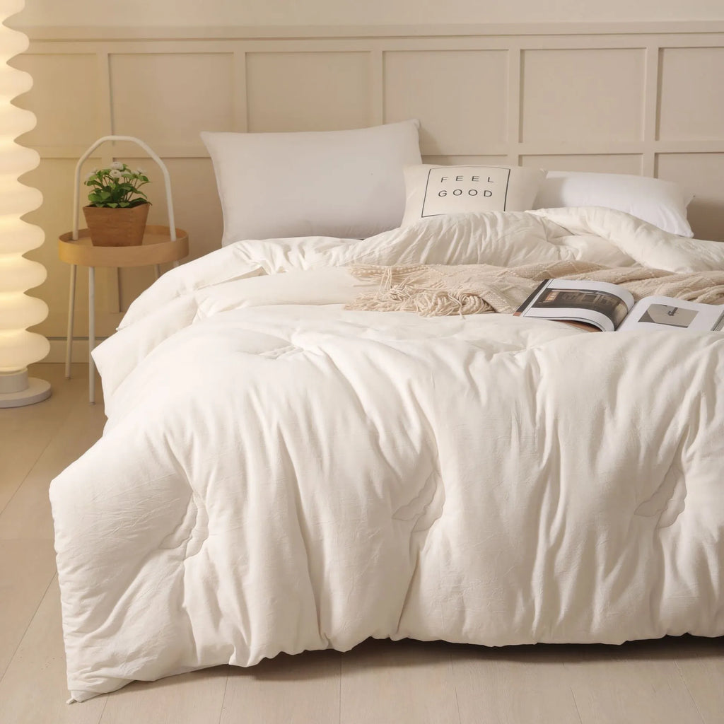 Soybean fibre pure cotton quilt in grey on a bed, showing twill weave fabric and neat stitching.