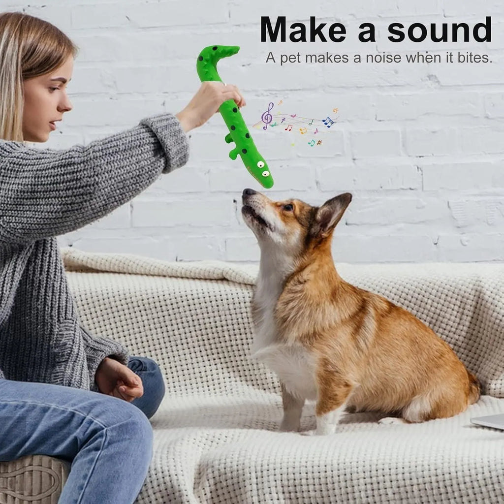 Green lizard-shaped dog chew toy with squeaker, measuring 24cm long