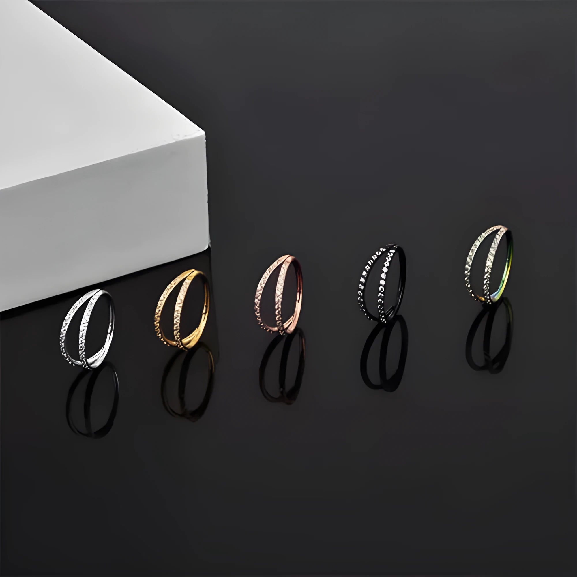 G23 titanium alloy body jewellery ring in gold or steel colour with diamond treatment, showing hoop design.