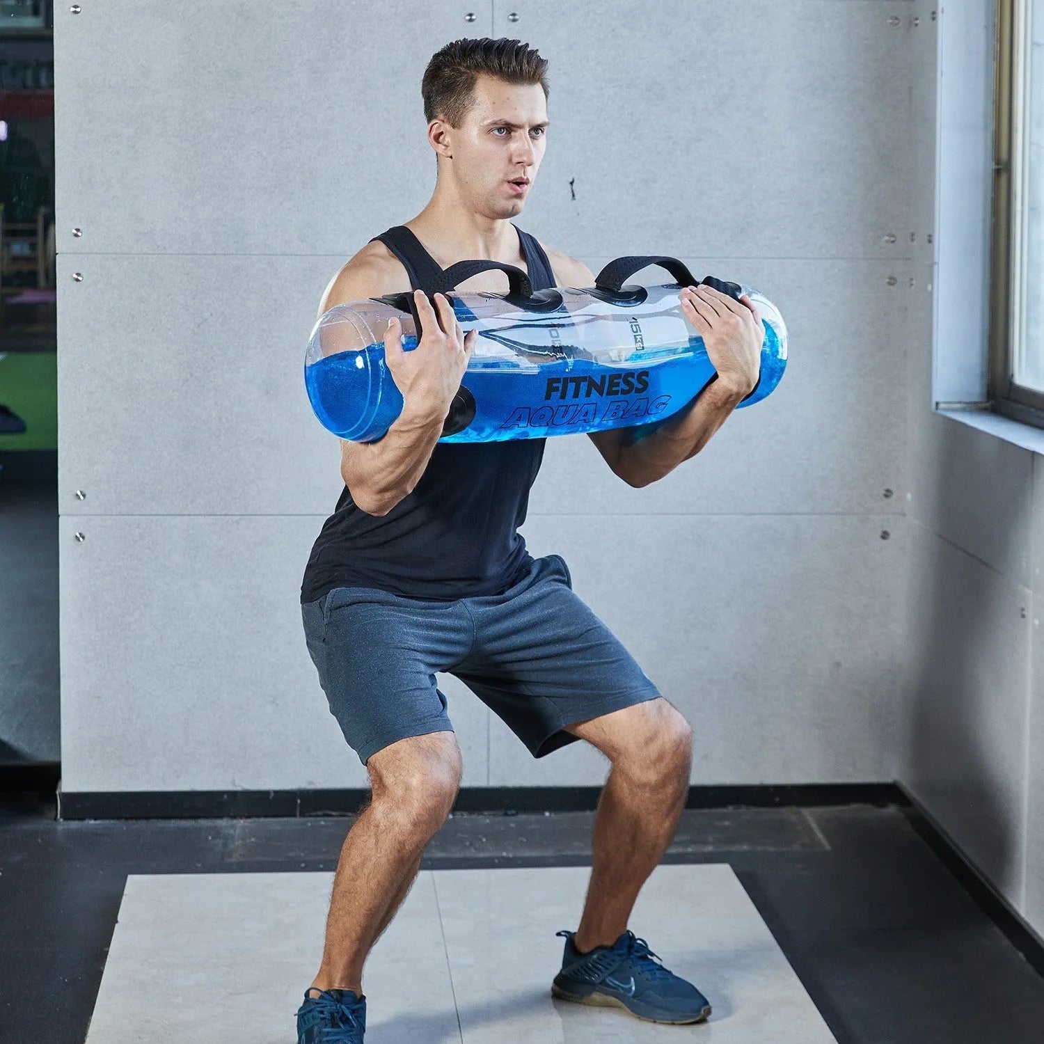 Transparent PVC inflatable water dumbbell bag for adjustable weight training.