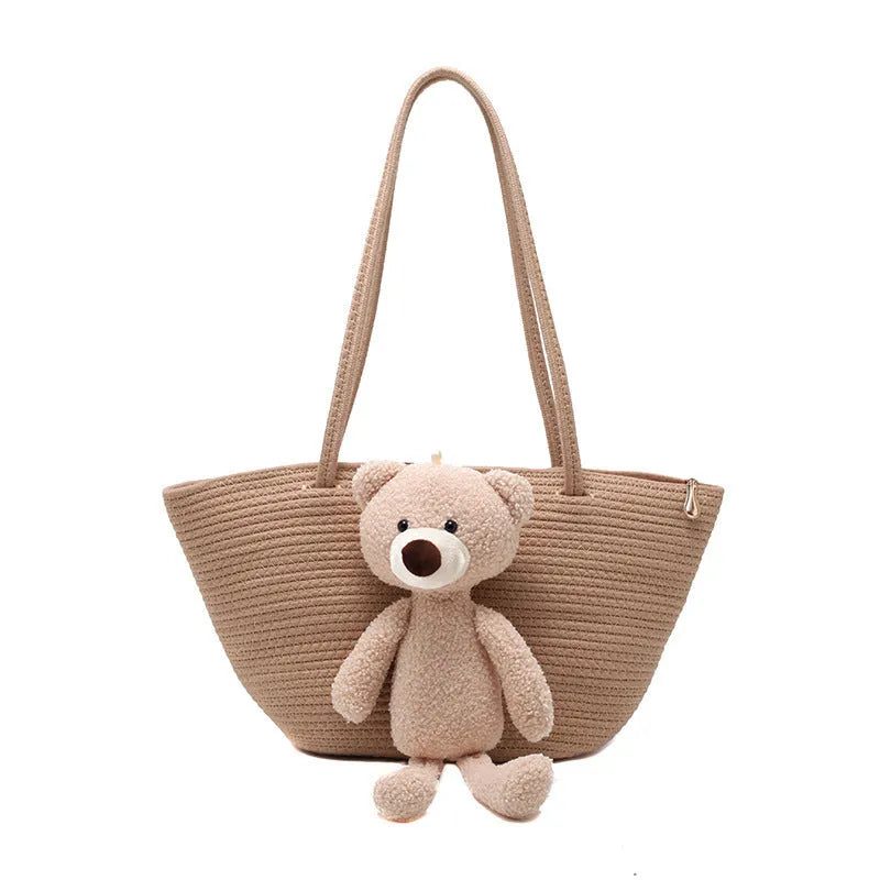 Cotton linen woven bag in dumpling shape with double shoulder straps and woven detailing