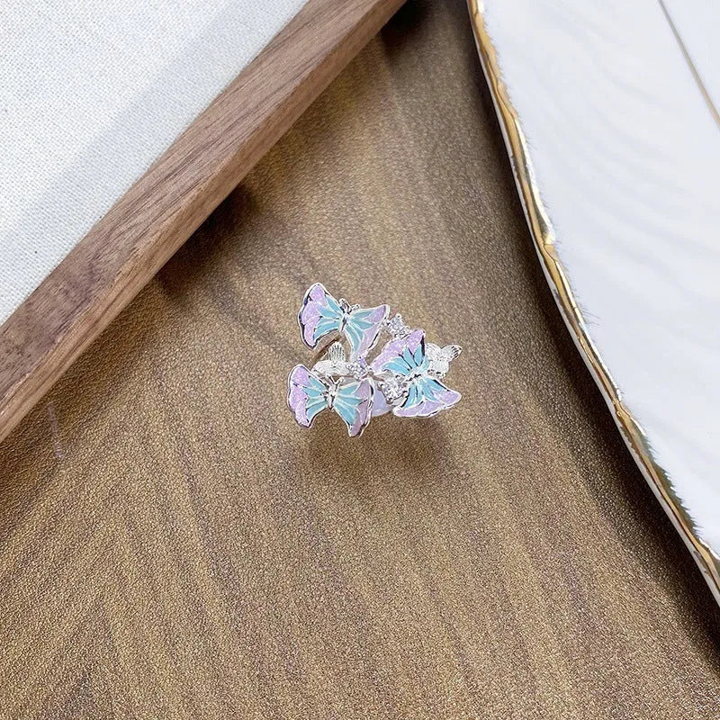 Adjustable copper insect motif ring with oil-drip finish in three colour options