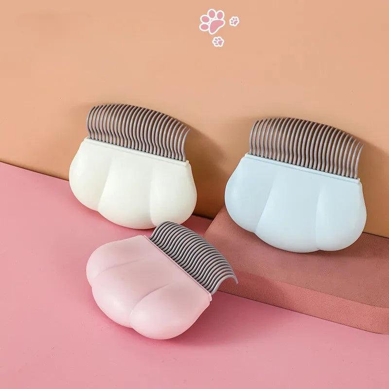 Blue Paw Soft deshedding brush for cats and dogs on a white background