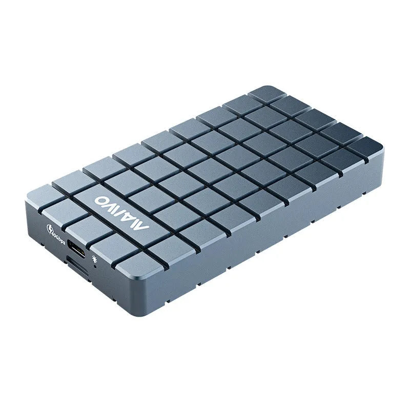 Silver aluminium USB4 hard disk box with connectors, shown next to a notebook computer