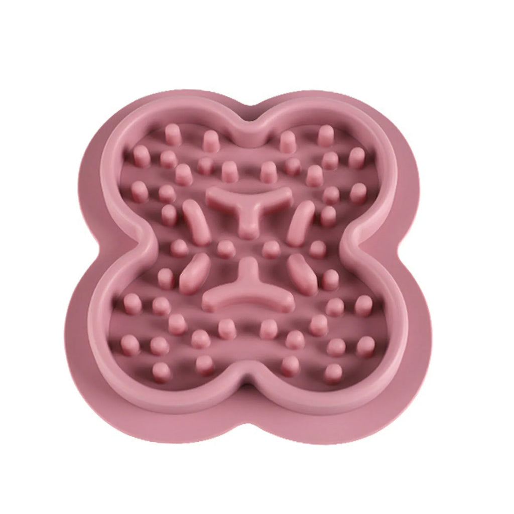 Silicone pet licking mat slow feeder in blue on a kitchen floor