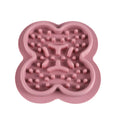 Silicone pet licking mat slow feeder in blue on a kitchen floor