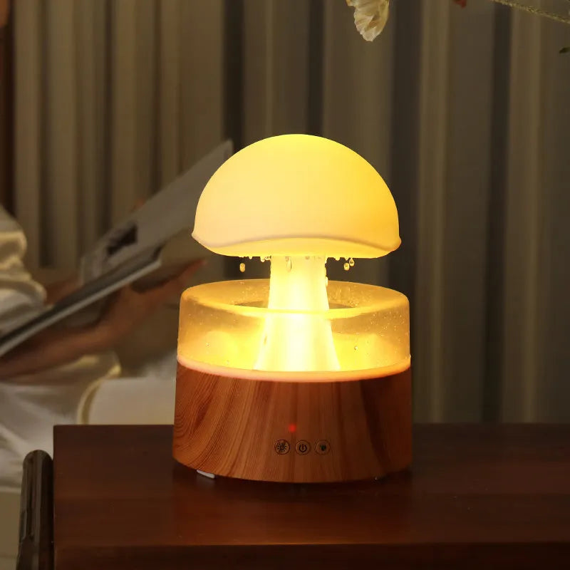 White cloud-shaped humidifier with LED lights and simulated rainfall, includes remote control