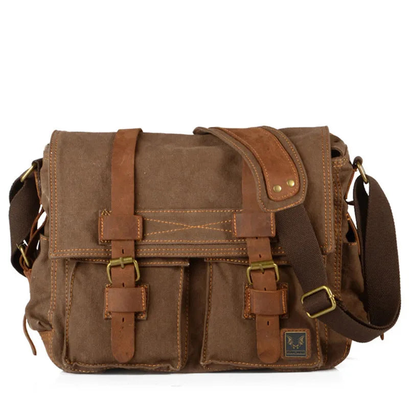 Men's brown canvas crossbody shoulder bag with cowhide trim and flap closure.