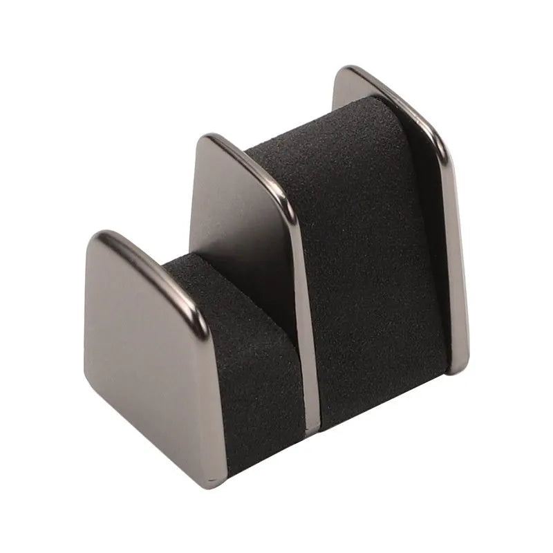 Zinc alloy and leather car dashboard clip for holding sunglasses, shown in green colour.