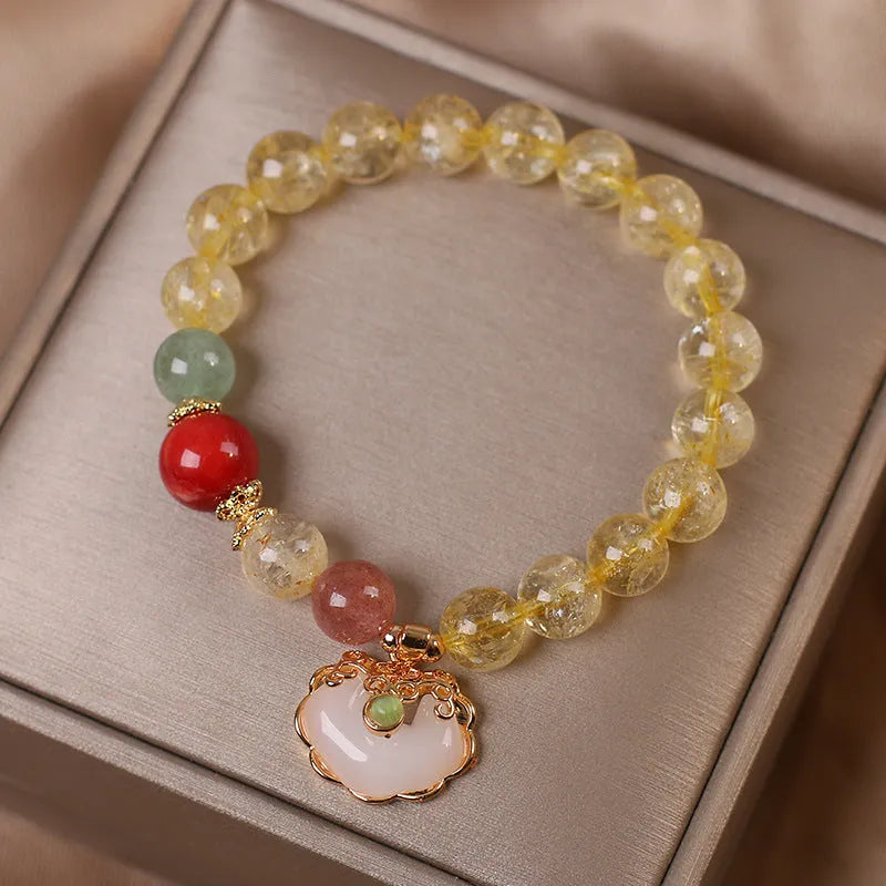Women's bracelet with a natural yellow citrine jade ruyi pendant on an alloy chain