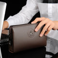 Men's business casual clutch made of soft PU leather, black, with visible sewing line detail and anti-theft design